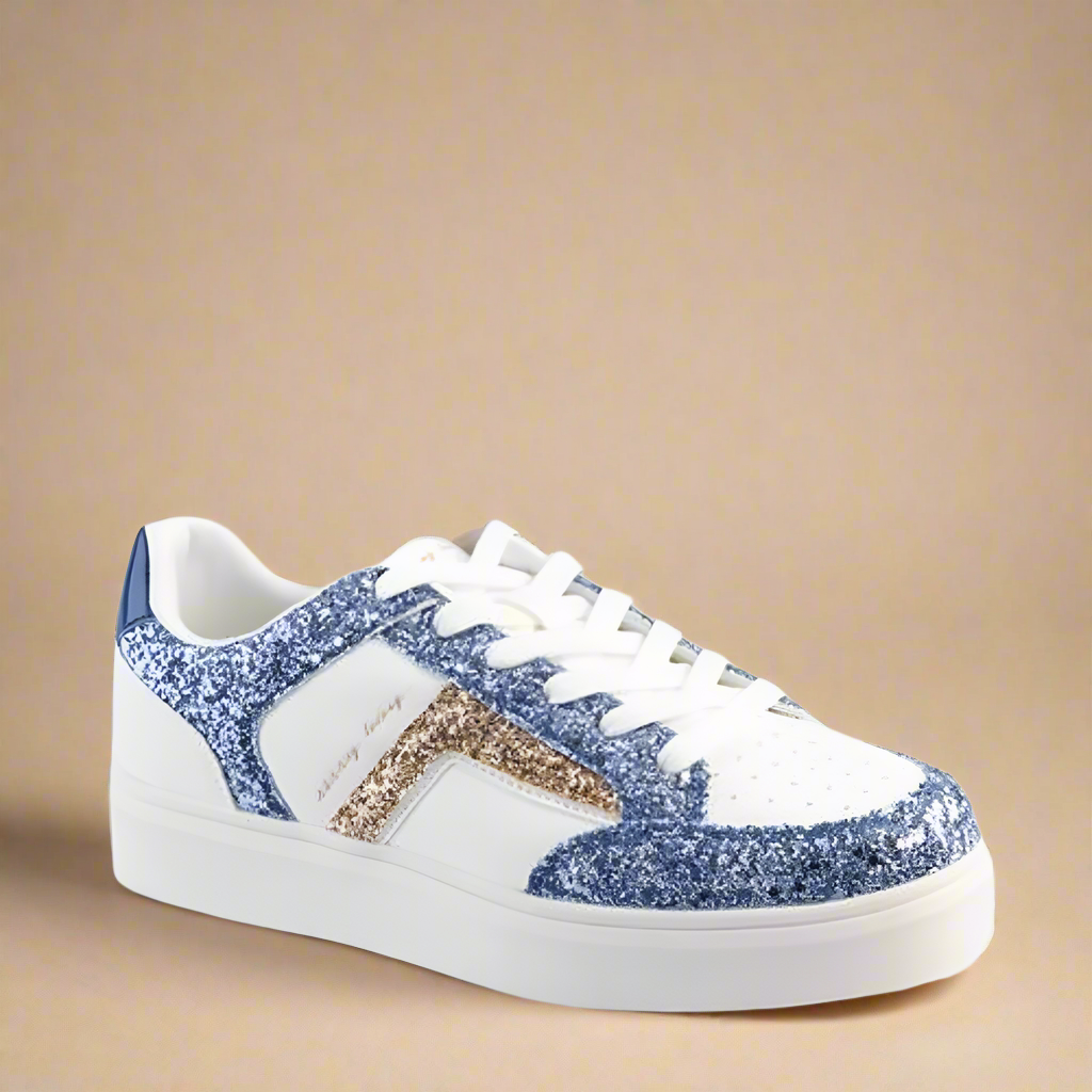 Angled view of the Glitter Outline Sneaker highlighting the shimmering blue glitter outline against the white base.