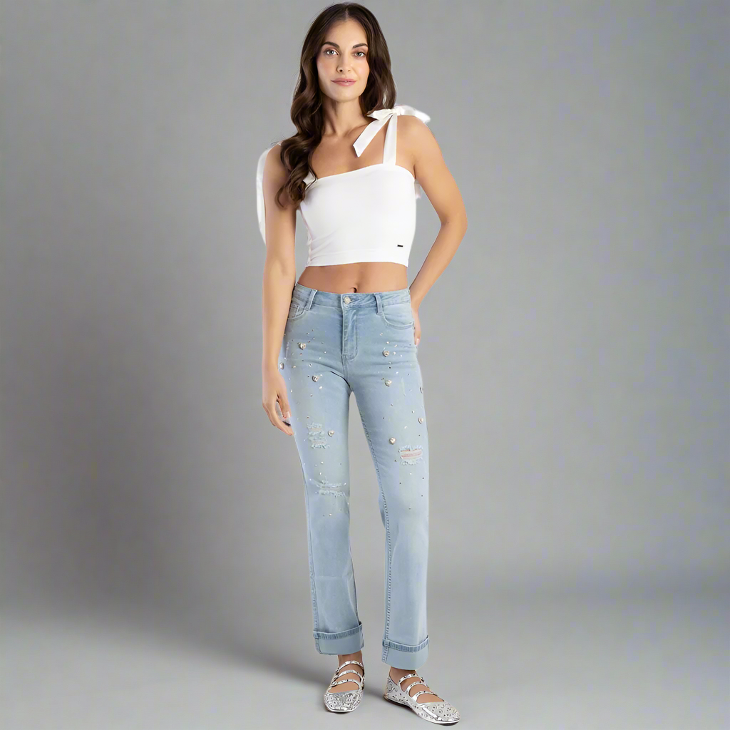 Sissy Boy Frieda Straight Leg Jeans on a model, showcasing the high waist and straight leg design, paired with a casual white top.