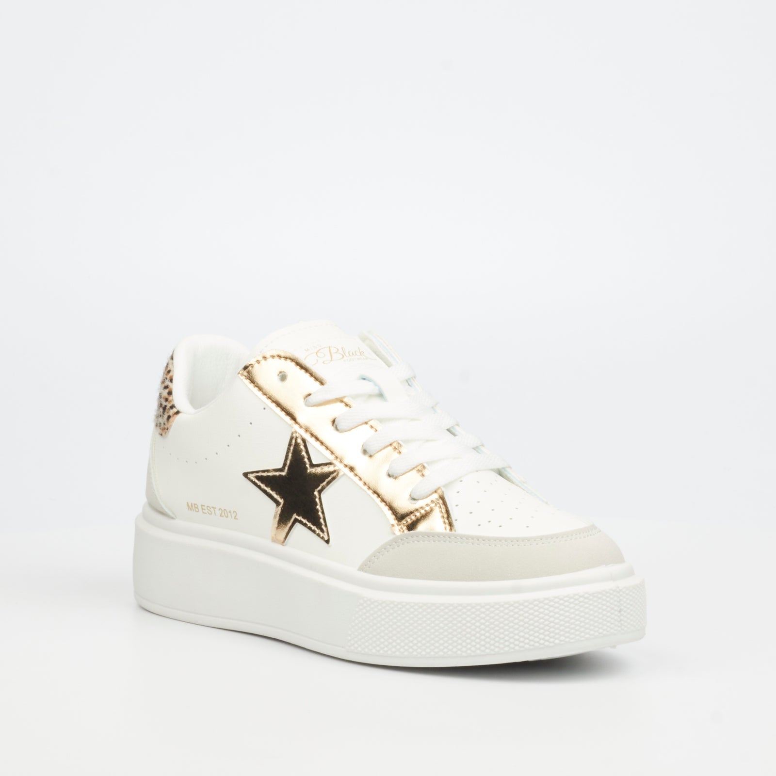 Fashionable white women's sneaker with metallic gold star and chunky sole